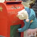 A child investigates the mailbox for Santa.