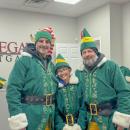Elves Adam Barboza, Tatum Barboza and Joey Inacio pose for a photo. 