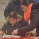 Alexander Couto, 6, decorates a cookie.