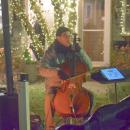 The Punk Cellist plays for those visiting the village. 