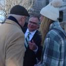 Chris Markey introduces his daughter to a supporter. 