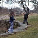 Two children run along the stone fence at Round the Bend Farm. Photos by Kat Sheridan