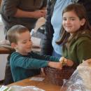 Jed, 5, and Willow Lord examine the produce for sale. 