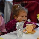 Lilian Grace Mather, age 2, perfects her tea.