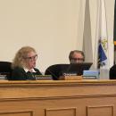 Heidi Silva-Brook gifts Stanley Mickelson his citation. 