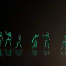 The first number featured glowing, dancing stick figures.