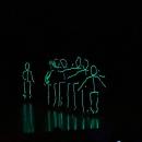 The first number featured glowing, dancing stick figures.