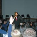 Hayden Igisomar asks the audience trivia questions.