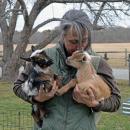 Shannon Lawrence snuggles with the baby goats. Photos by Kat Sheridan