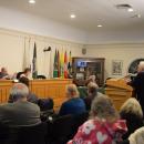 Michael Medeiros and Dave Calhoun argue over details of the proposed apartments. 
