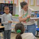 Brittany Travassos examines the photos left by the perpetrator. 