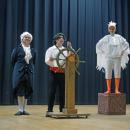 Grimsby (Hudson Igisomar), Prince Eric (Julian Lazaro) and Scuttle (Nyah Suarez) pose onstage.