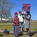 A group has a conversation while protesting.