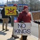 A woman demands no kings as a part of her protest.