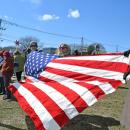 A number of protesters brought a large American flag.