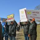 Many of the signs called for no kings.