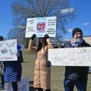Some of the protesters standing and protesting together.