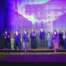 The cast sings about their displeasure of the Communist times they llive in. 