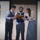 Dimirtry (Jack Nylin,) Vlad (Nolan Woodard,) and Anya (Emerson Palumbo) look at a book on the royal family. 