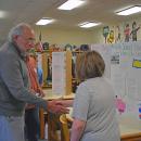 David Tatelbaum shakes Isaac Parsons' hand. 