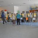 Voters at the Dartmouth Youth Athletic Association fill in their ballots. 