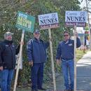 Nathan Silva and two others campaign for him outside the Council on Aging. 