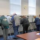 Voters at Town Hall fill in their ballots. 