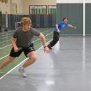 Coach John Breault watches Aidan Gendron race Jason Sullivan. Photos by Kat Sheridan