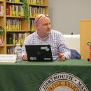 Chris Oliver speaking at a previous meeting. Stock photo. 