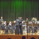 Noah Veloso hugs percussion director Alex Ollivierre. 
