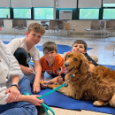 Henry Niemic, age 10, Landon Guile, age 11 and Jacob Sousa, age 9 pose with Enzo. 