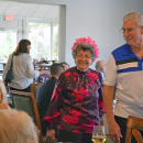 Linda and John Oggenfuss enter the luncheon. 