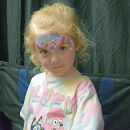 Isabelle, 3, shows off her unicorn face paint. 