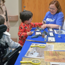Joseph, 4, and Thomas, 5, learn about the New Bedford Whaling Museum. . 
