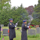The Dartmouth Police Department performs a gun salute. 