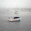 A boat floats past to view the ceremony. 