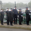 The Dartmouth Police Department performs a gun salute. 