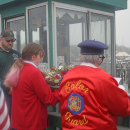 Members of the Color Guard prepare to toss the wreath. 
