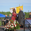 A student receives her diploma. 