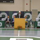 Peter Rossi welcomes the families and graduates. 