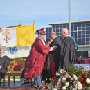 A student receives his diploma. 