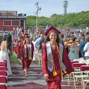 The students enter into the graduation. 