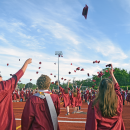 The students toss their caps in the air. Photos by Kat Sheridan