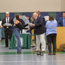 A student receives her diploma. 