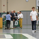 A student reveives his diploma. 
