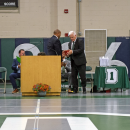 Marc Hayes gives Peter Rossi the Golden Apple. 