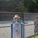 Select Board Chair Heidi Silva-Brooks welcomes people to the park. 