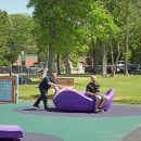 Members of the Dartmouth Community media enjoy the play set. 