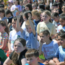 Some students celebrate the opening of the playground. 