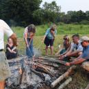 A group roasts hot dogs around the fire. Photos by Kat Sheridan